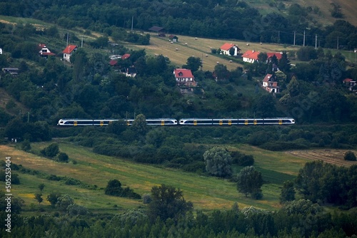 Railway line in rural landscape photo