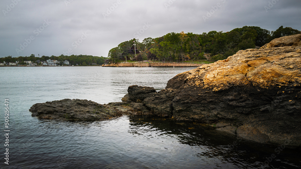 Turtle head-shaped rocks in Branford bay in Connecticut. Moody seascape on stormy weather in New England, USA. Turtle head-shaped rocks in Branford bay in Connecticut. Moody seascape on stormy weather in New England, USA.