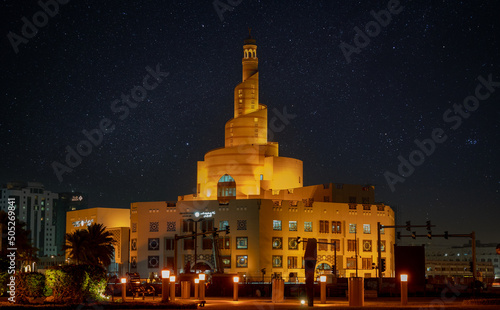 View of fanar building during the night from the souq waqif park photo