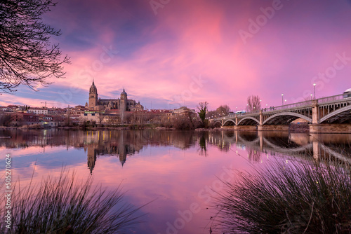 Salamanca Skyline view with Cathedral and Enrique Estevan Bridge on Tormes River, Spain photo