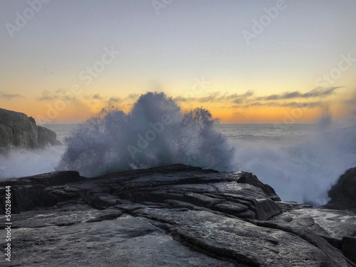 Beautiful sunset on the coastal edge of the beaches of Punta Tralca in Chile photo