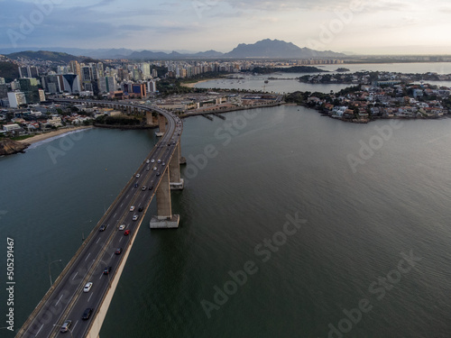 Amazing coastal city one of the capitals of Brazil Vitoria with long bridge over the canal - aerial drone view © Rodrigo