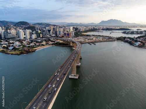 Amazing coastal city one of the capitals of Brazil Vitoria with long bridge over the canal - aerial drone view photo