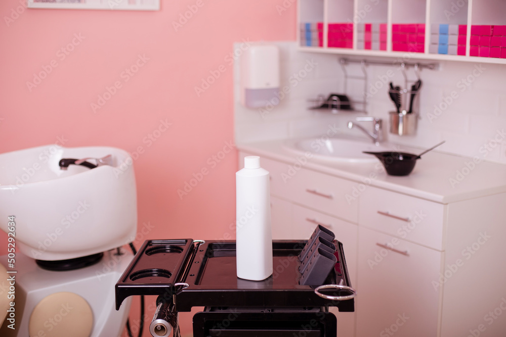 White bottle with hair care shampoo in hairdressing salon
White bottle with hair care shampoo in hairdressing salon
