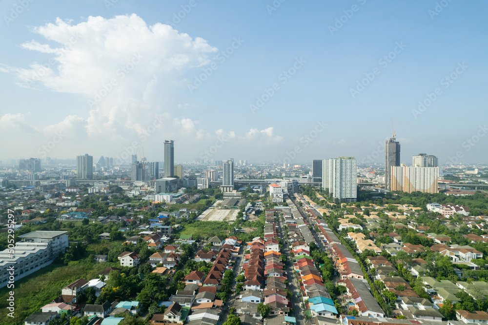 Obraz premium Aerial view of the roof of a house with a car taken by a drone, top view of road