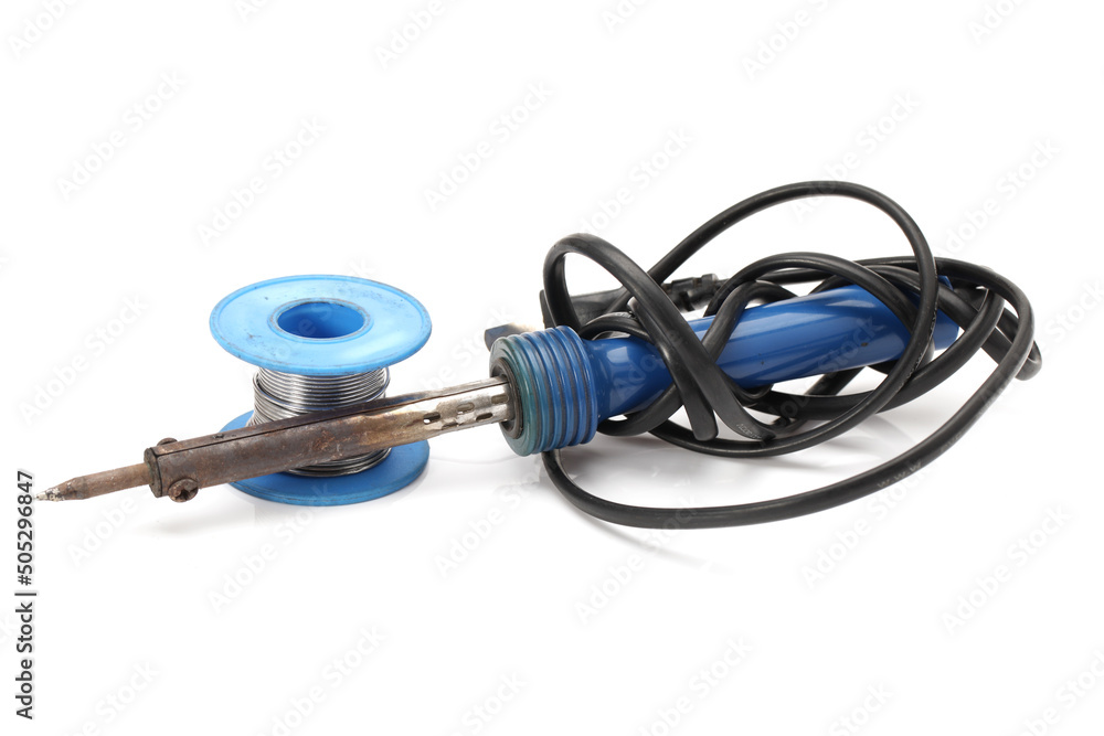 Electric soldering iron with the blue handle and Roll of soldering wire on a white background Electric soldering iron with the blue handle and Roll of soldering wire on a white background