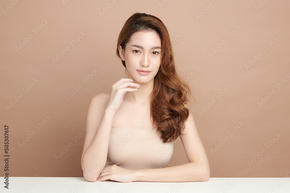 Beautiful young asian woman with clean fresh skin on beige background, Face care, Facial treatment, Cosmetology, beauty and spa, Asian women portrait. Beautiful young asian woman with clean fresh skin on beige background, Face care, Facial treatment, Cosmetology, beauty and spa, Asian women portrait.
