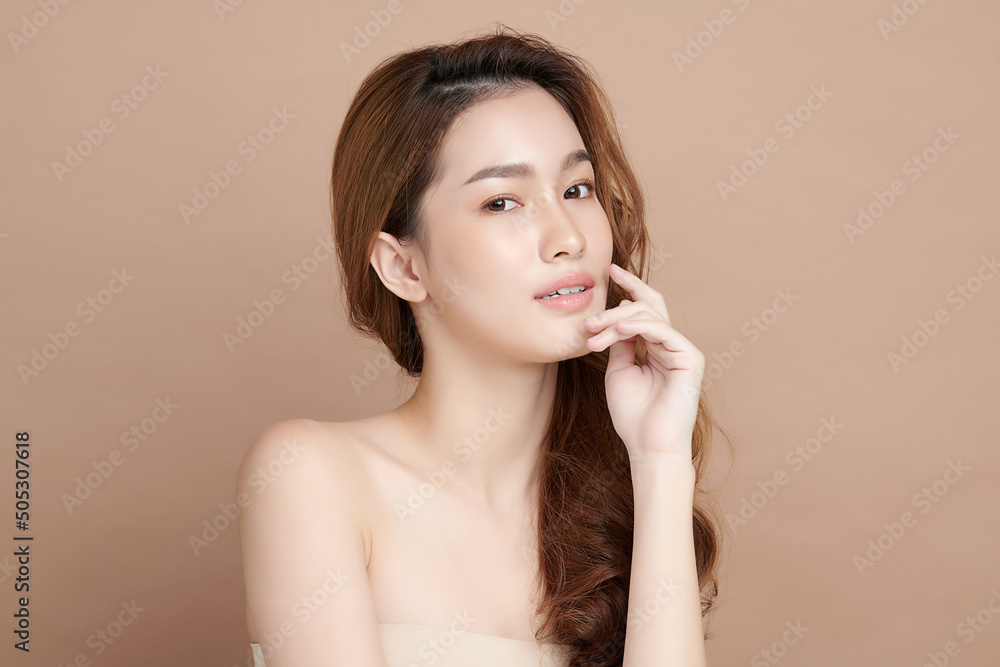 Beautiful young asian woman with clean fresh skin on beige background, Face care, Facial treatment, Cosmetology, beauty and spa, Asian women portrait. Beautiful young asian woman with clean fresh skin on beige background, Face care, Facial treatment, Cosmetology, beauty and spa, Asian women portrait.