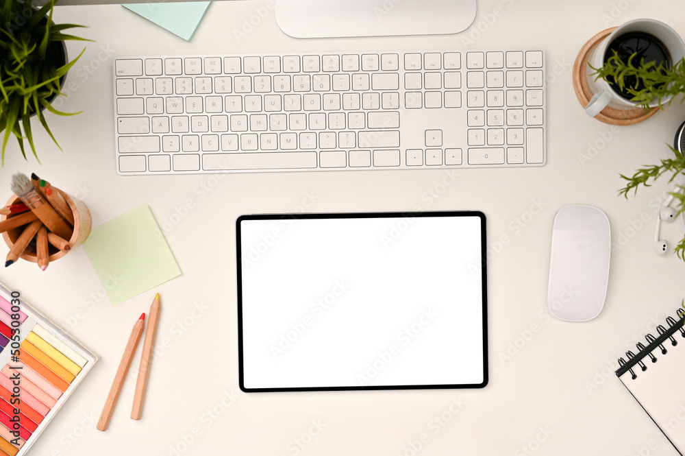 Minimal white office desk workspace top view with empty screen tablet touchpad Minimal white office desk workspace top view with empty screen tablet touchpad