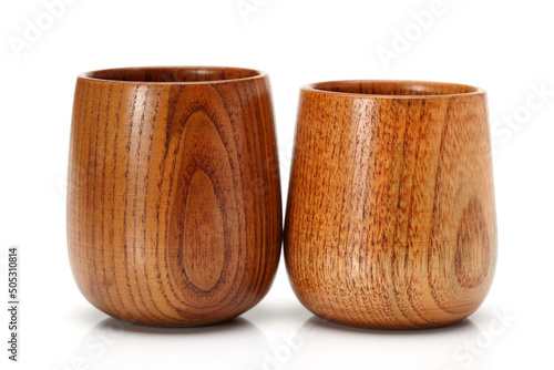 wood craft (cups, bowl, spoons, scoops) on white background