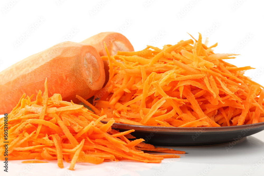 The polished carrots on a white background The polished carrots on a white background