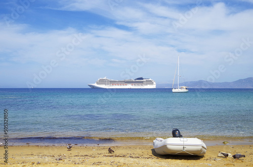 Modern Italian cruiseship cruiseship liner Magnifica anchoring at sea during Summer Aegean Mediterranean Greek Islands Mykonos cruising photo