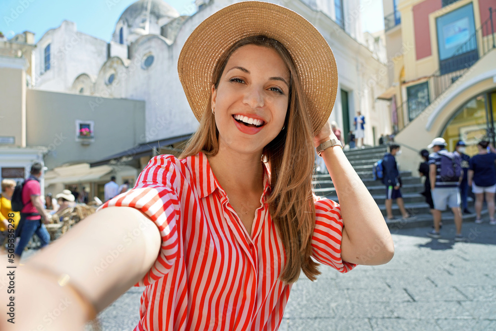 Φωτογραφία Beautiful fashion girl with striped dress and hat taking selfie photo in Capri P