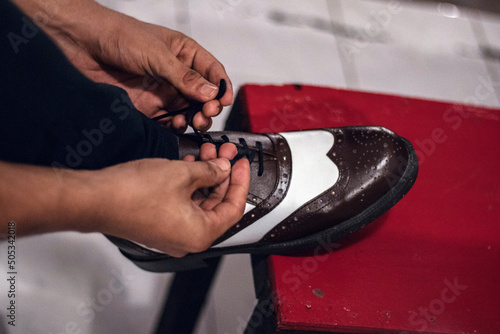 Canvas Print Two tone brogue wingtip shoes in brown and white that are elegant because they a