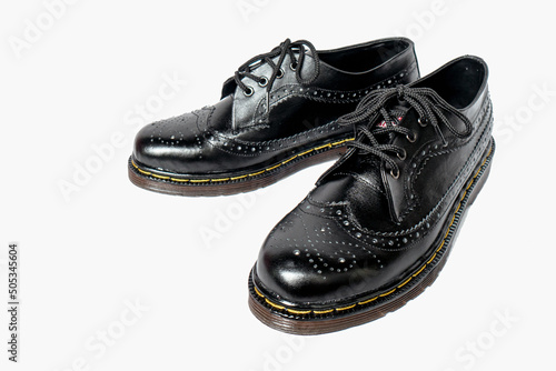 Photography Full black brogue wingtip shoes made of genuine cowhide with a detailed pattern