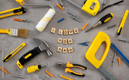 I love dad message with tools for repair saw nippers hammer . top view flat lay. Father's Day concept