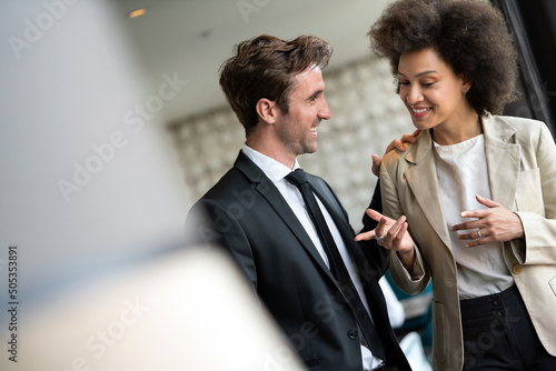 Young couple of professionals chatting during a coffee break