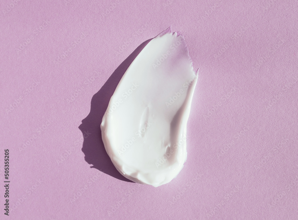 smear of white cream on a pink background
smear of white cream on a pink background