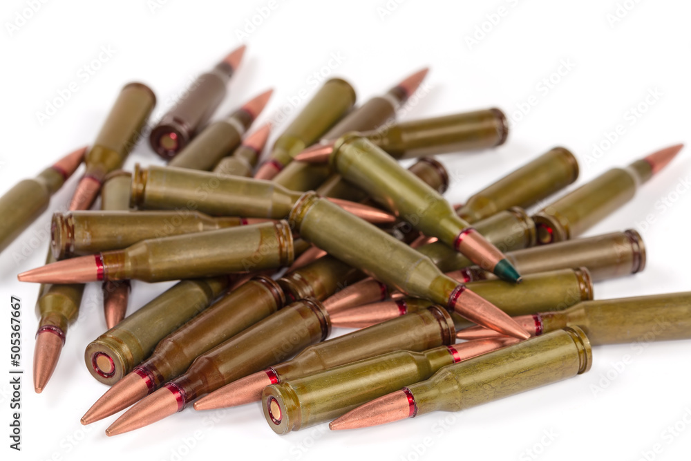 Heap of service rifle cartridges, close-up in selective focus Heap of service rifle cartridges, close-up in selective focus
