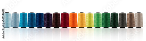 Spool of sewing thread, isolated on white background. Colored yarns used by factories in the clothing industry. Threads wound on the spool. Colored reels