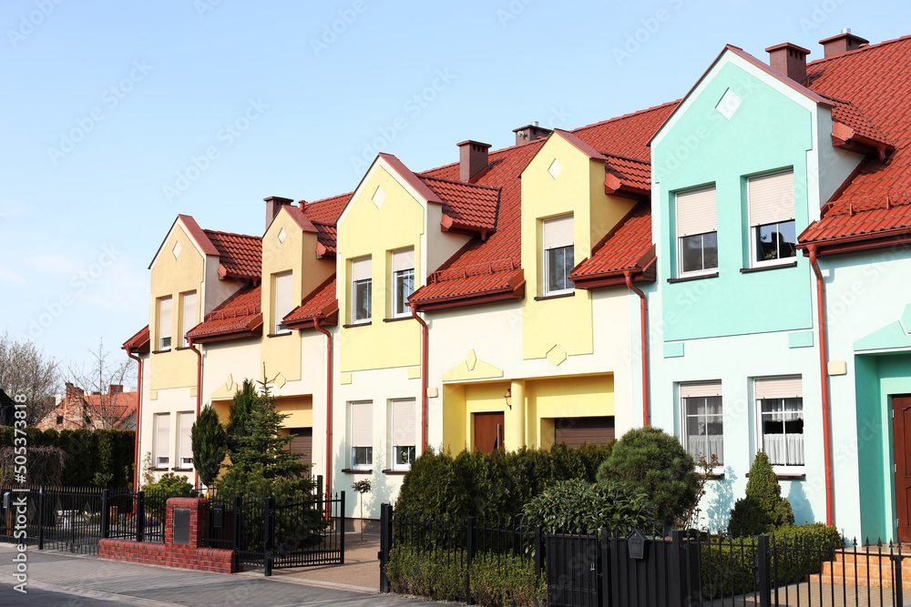 Block of houses outdoors on sunny day