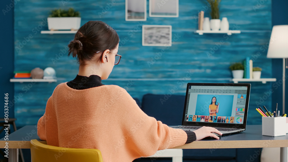 Φωτογραφία Graphic designer retouching picture for online editing class on laptop, using software to grade color for multimedia production