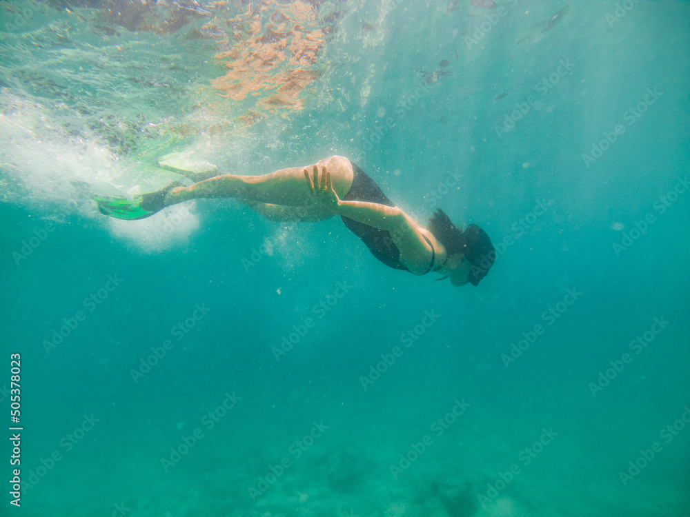 woman in snorkeling mask underwater