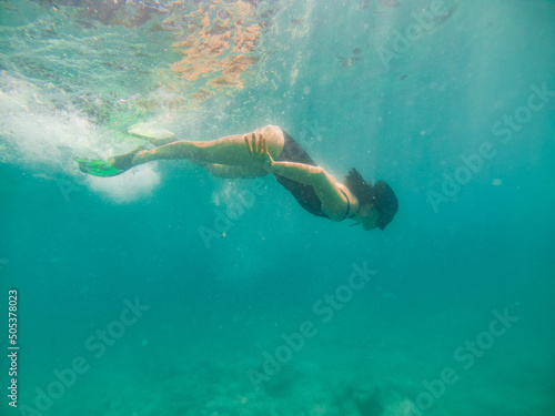 woman in snorkeling mask underwater