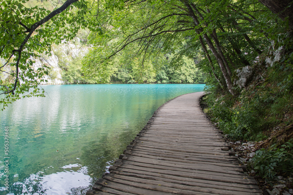 Plitvice Lakes National Park, Croatia, Europe: View to the beautiful turquoise water while hiking along the boardwalk. Plitvice Lakes National Park, Croatia, Europe: View to the beautiful turquoise water while hiking along the boardwalk.