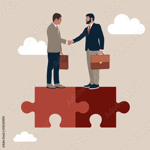 Success businessmen finish deal and handshake on jigsaw puzzle. Collaborate, cooperate or partnership and agreement to help business success, together or teamwork support each other concept.