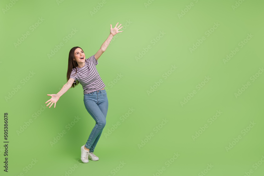 Full length body size view of attractive cheerful funny girl hugging copy space isolated over bright green color background