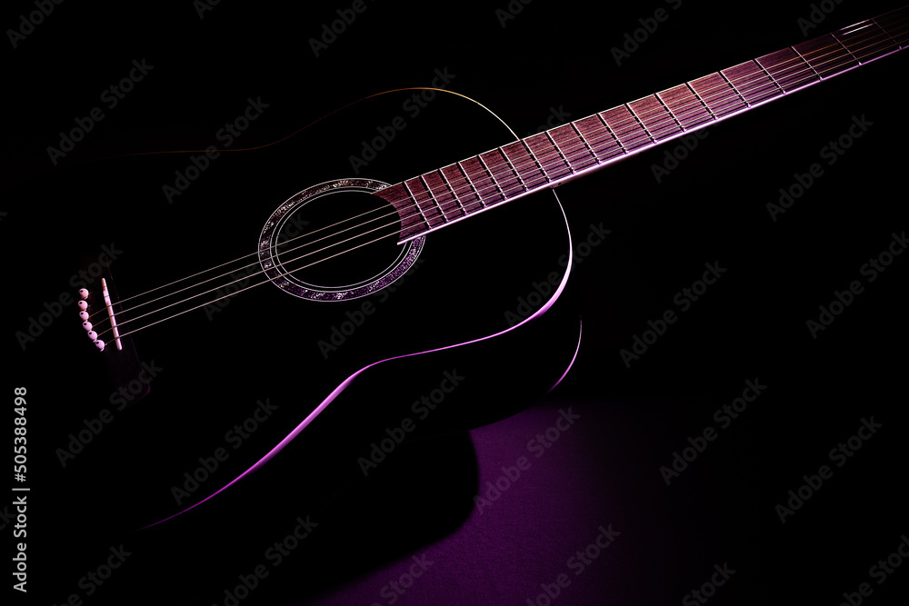 black guitar isometric view close-up. guitar music low-key concept