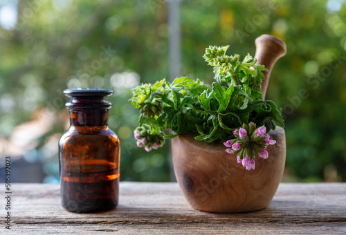 Citronella geranium essential oil on table, close up. Aromatherapy oil, mosquito repellent