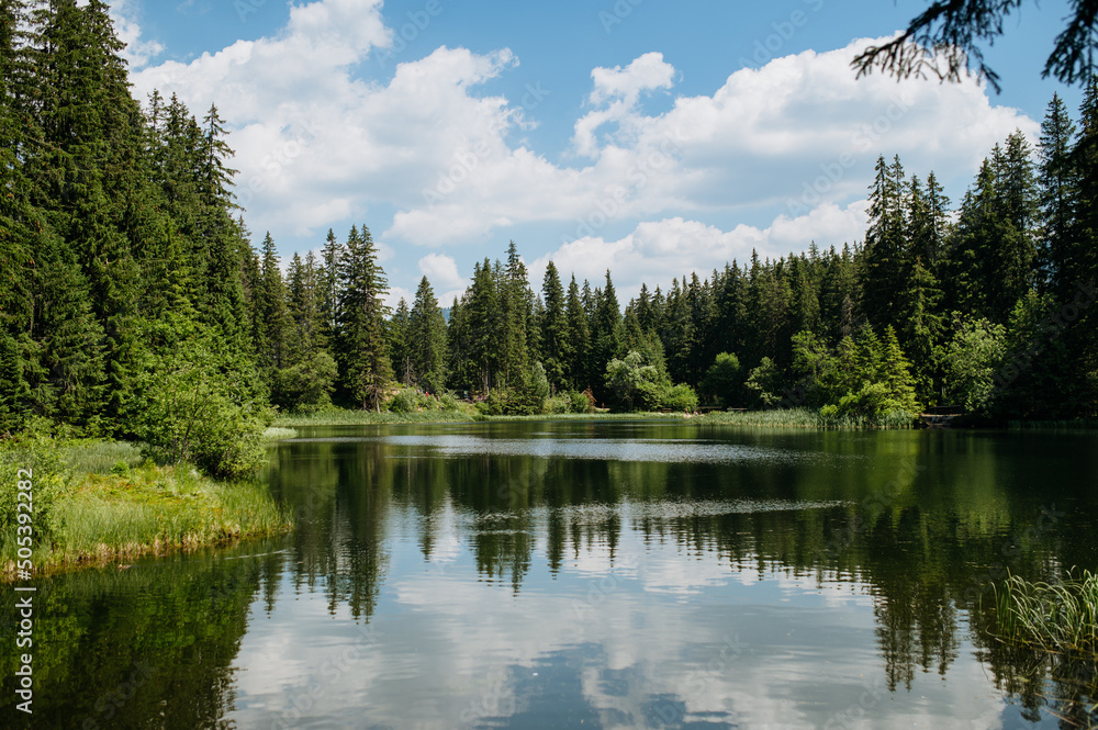 A beautiful landscape of mountain lake in Slovak Tatras on summer sunny day. A beautiful landscape of mountain lake in Slovak Tatras on summer sunny day.