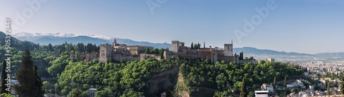 Panorama of la Alhambra, the muslim fortress and palace of Granada, and the snowed mountains of Sierra Nevada