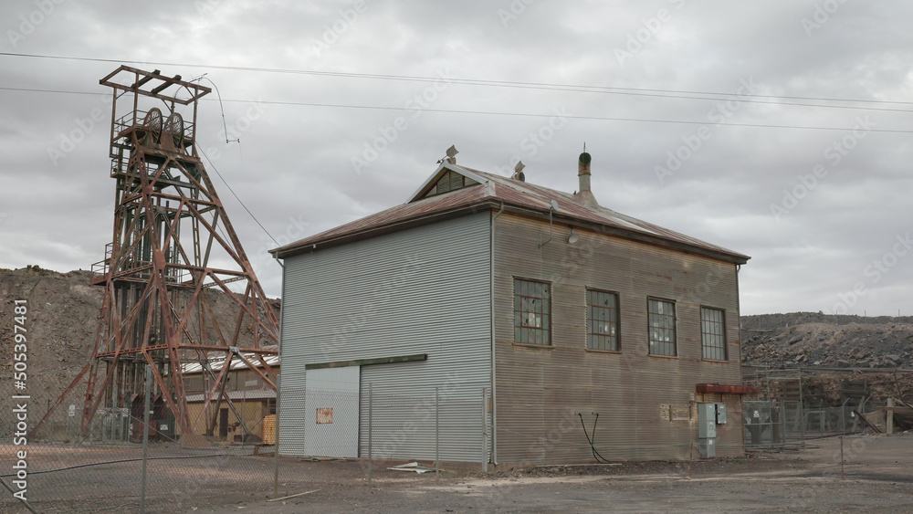 headframe and derelict building at broken hill headframe and derelict building at broken hill