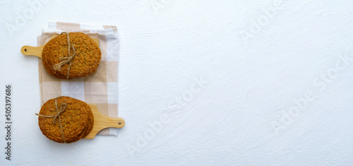 Oatmeal cookies prepared on a plate in kitchen. Making craft cookies. Flat lay. Copy space © Алексей Филатов