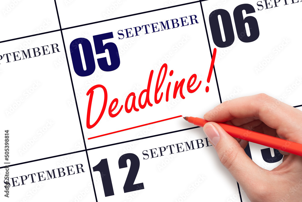 Hand drawing red line and writing the text Deadline on calendar date September 5. Deadline word written on calendar Hand drawing red line and writing the text Deadline on calendar date September 5. Deadline word written on calendar
