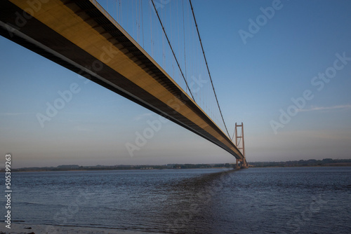 the Humber bridge crossing the river Humber during sunset