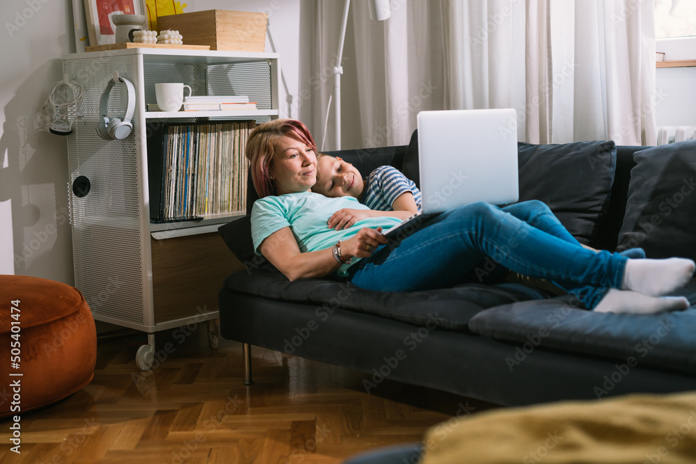 Obraz premium mother and son using laptop at home