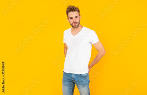 handsome man in shirt on yellow background, mens beauty