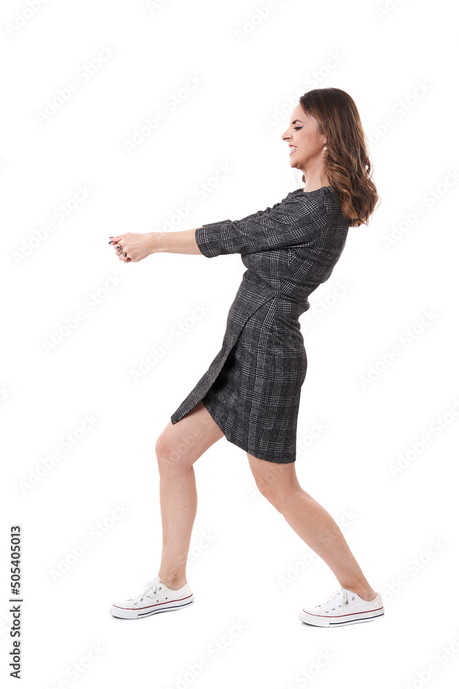 Businesswoman pulling an imaginary weight