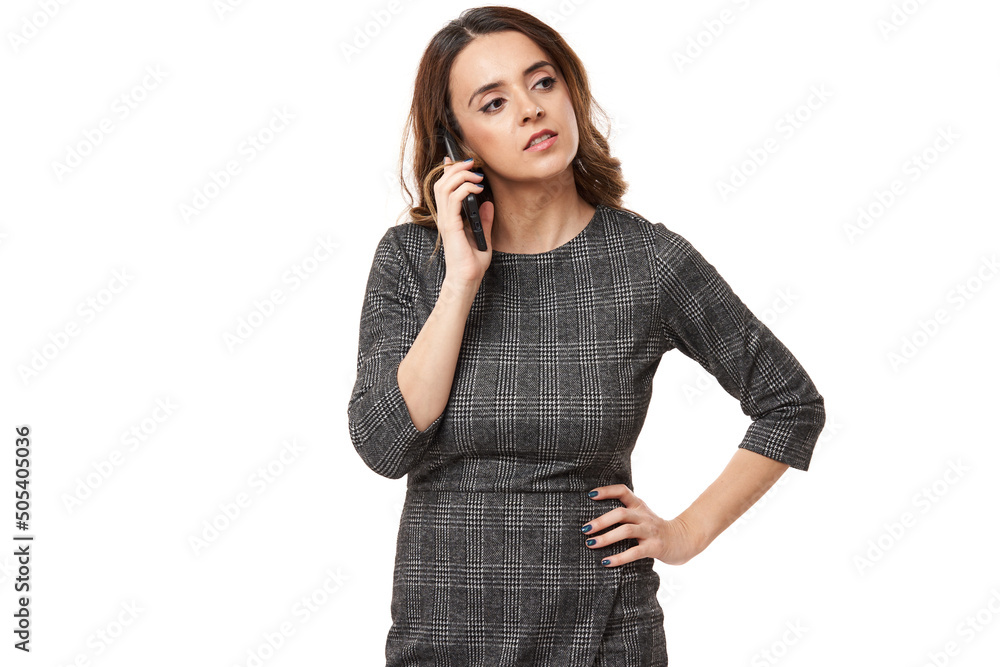 Businesswoman speaking on her smartphone, isolated on white Businesswoman speaking on her smartphone, isolated on white