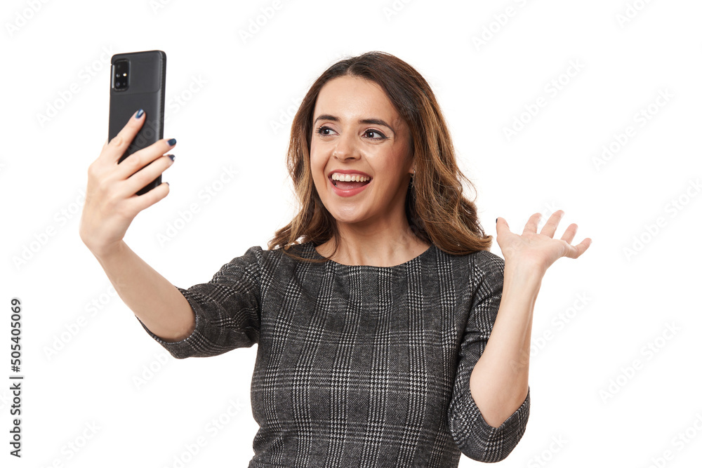 Happy businesswoman in a live video conference on her smartphone Happy businesswoman in a live video conference on her smartphone