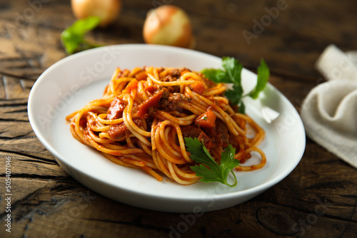 Spaghetti with tomatoes and lamb