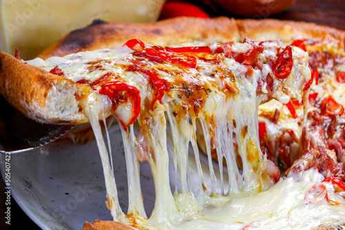 PizzaPepperoni pizza slice melted mozzarella cheese photo