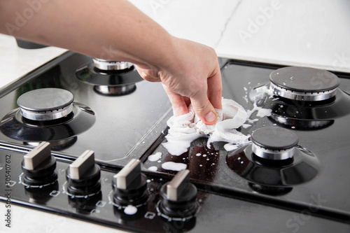 Cleaning and maintaining a gas hob. Degreasing, cleaner photo