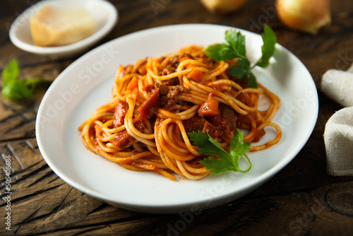 Spaghetti with tomatoes and lamb