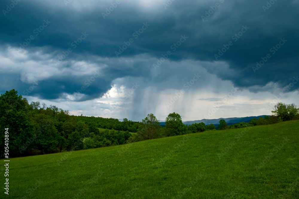 Mountain landscape with dramatic stormy clouds during the rain Mountain landscape with dramatic stormy clouds during the rain