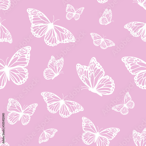 Vector seamless pattern with monarch butterflies on pink background